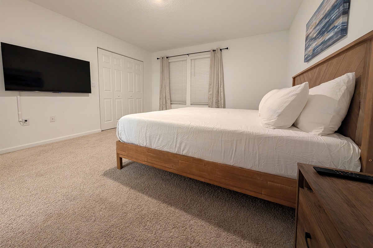 King bed with perfect TV views for ultimate relaxation