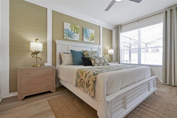 Tropical King Suite with pool view — bright, serene, and luxurious.