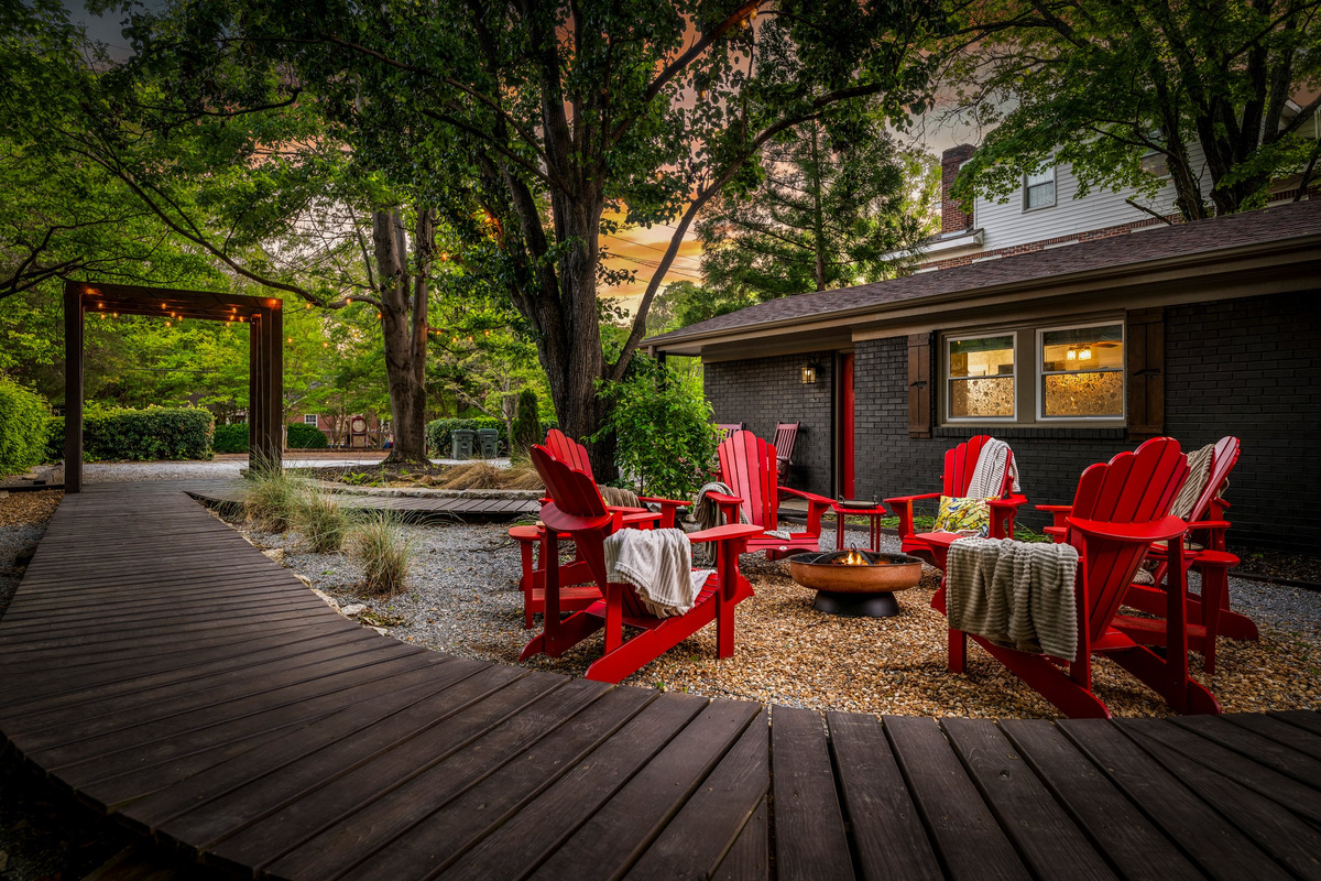Adirondack chairs surround the fire pit, creating a natural place to gather and unwind.