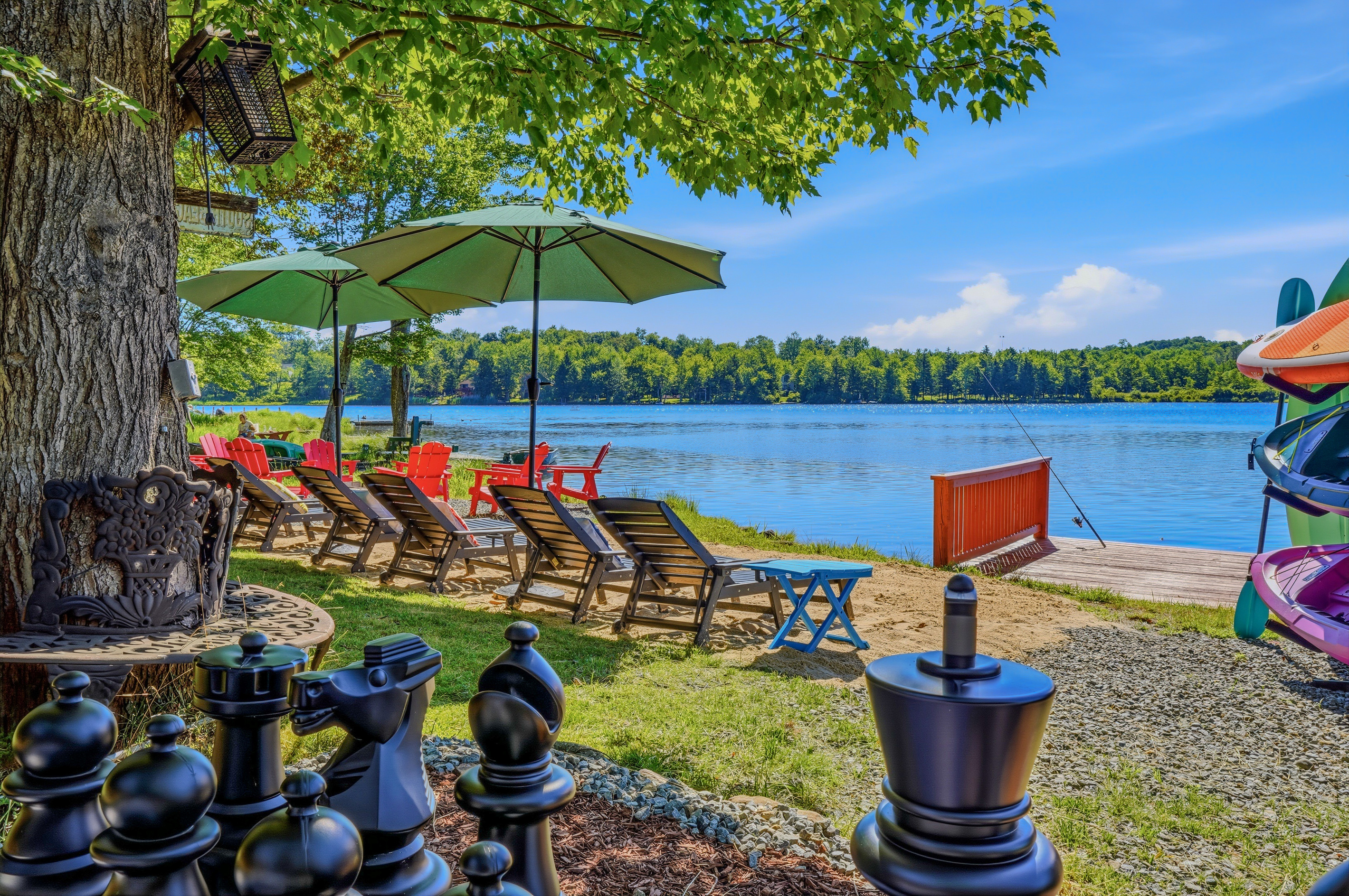 Giant chess set and sun loungers along the private Lake Carobeth shoreline