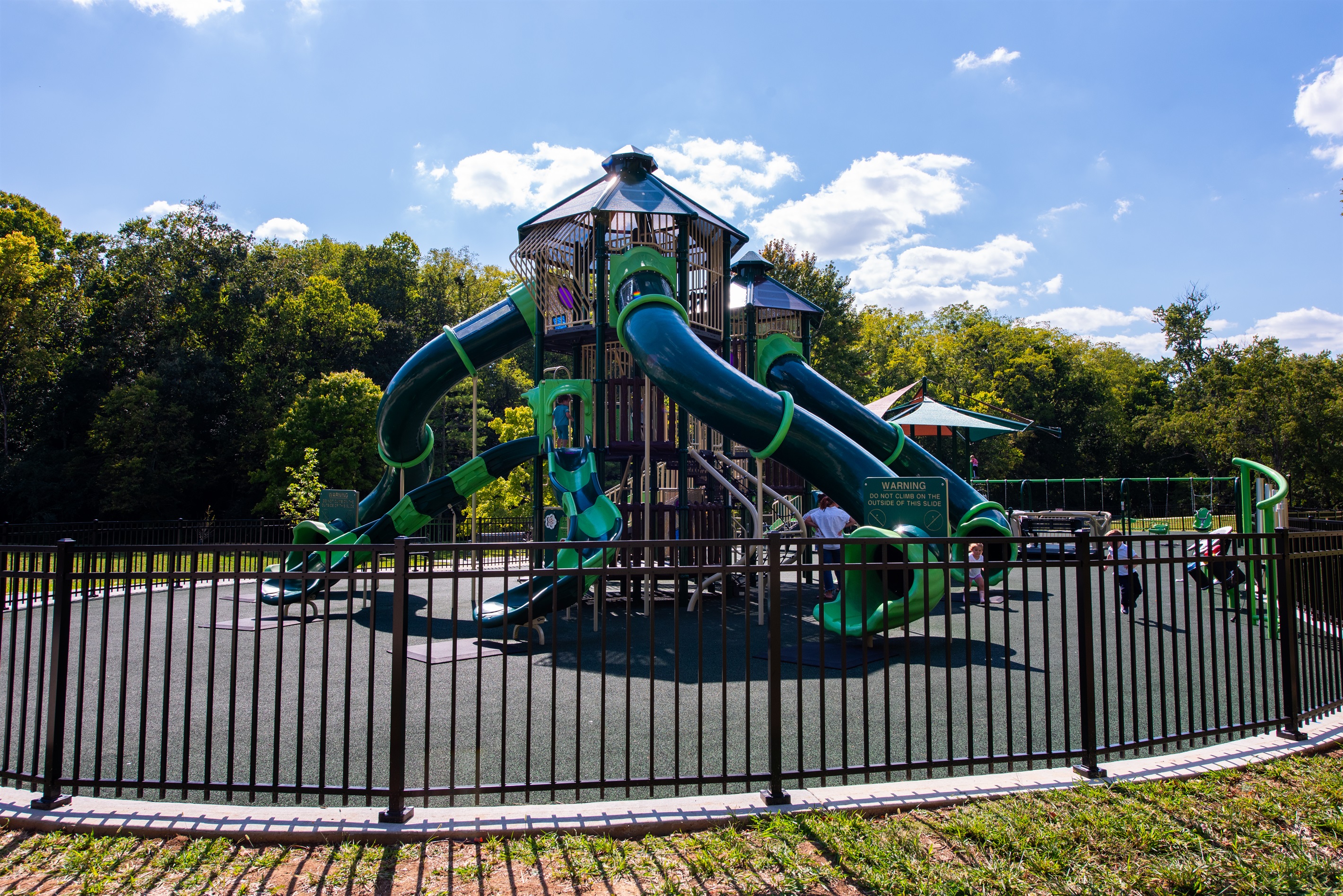 Big Springs Park features a family-friendly playground with slides, swings, and climbing structures that kids love. It’s a safe, shaded spot for little ones to burn off energy while parents relax nearby in the park’s open green space.