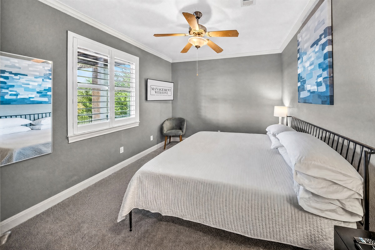 Second downstairs king bedroom offering the same comfort and layout, with a 42 inch TV and ample storage. Clean, simple, and designed for a restful stay.