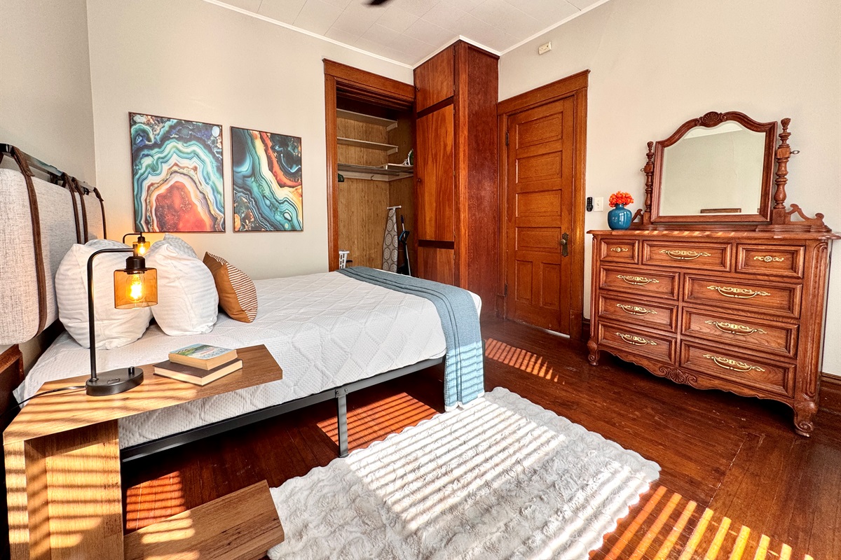 Lots of storage including a large walk in closet, huge storage cabinet and a gorgeous solid wood dresser with mirror.