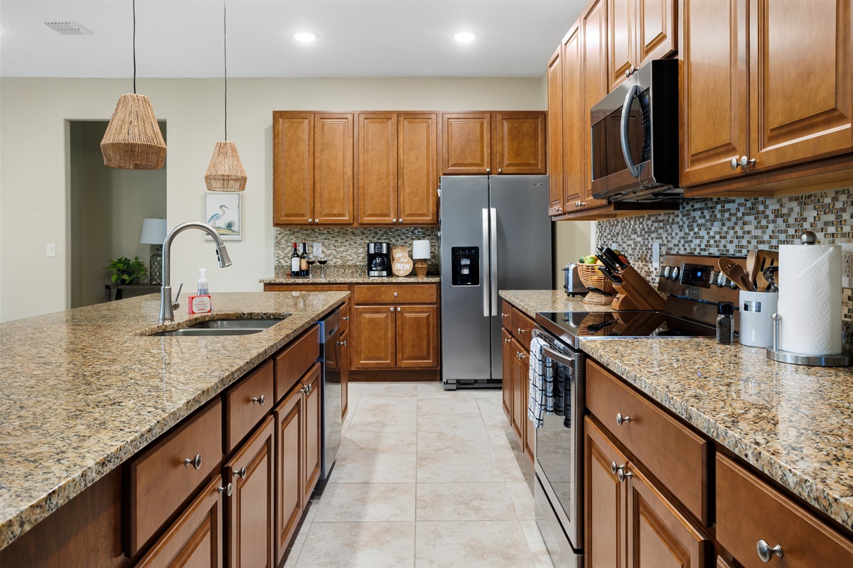 Plenty of cooking workspace, and fully stocked cabinets for all your cooking needs.