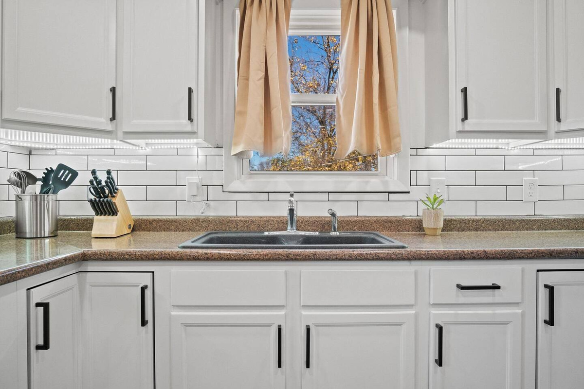 Clean and spacious kitchen faucet.