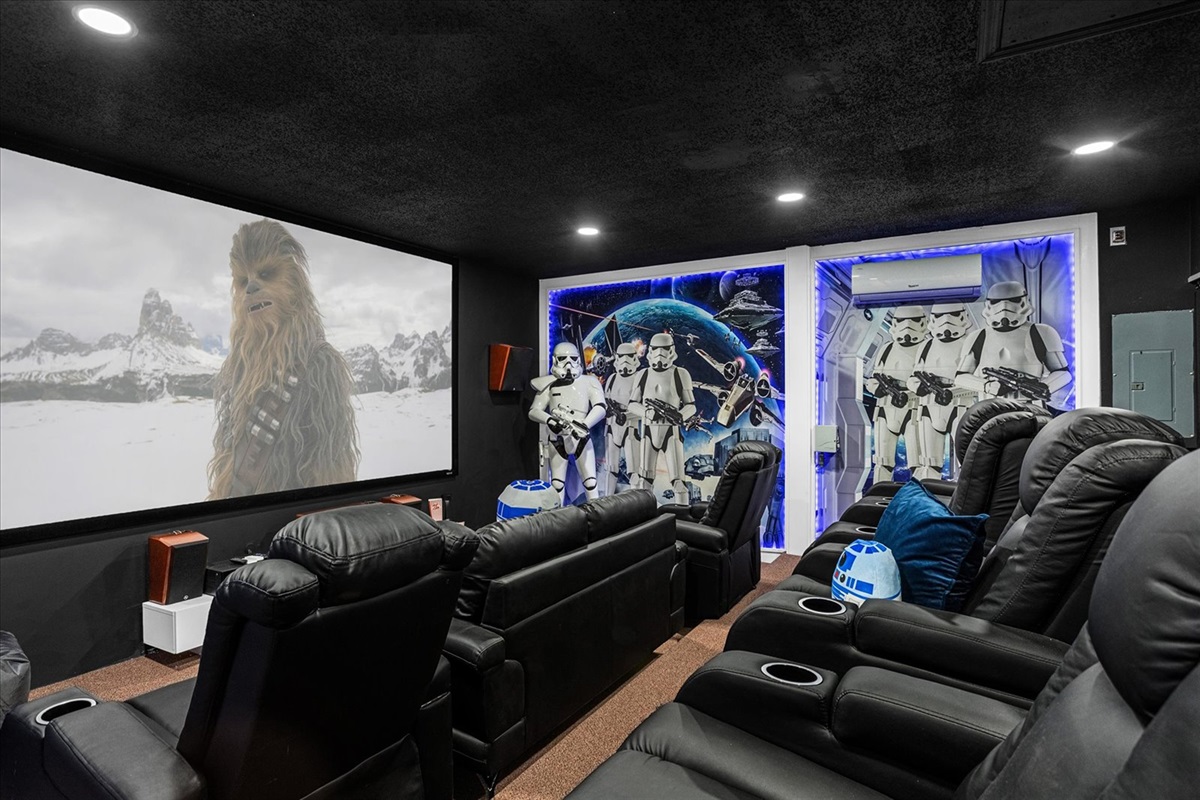 Enjoy immersive movie nights in this Star Wars themed 155" home theater with reclining seats and surround sound