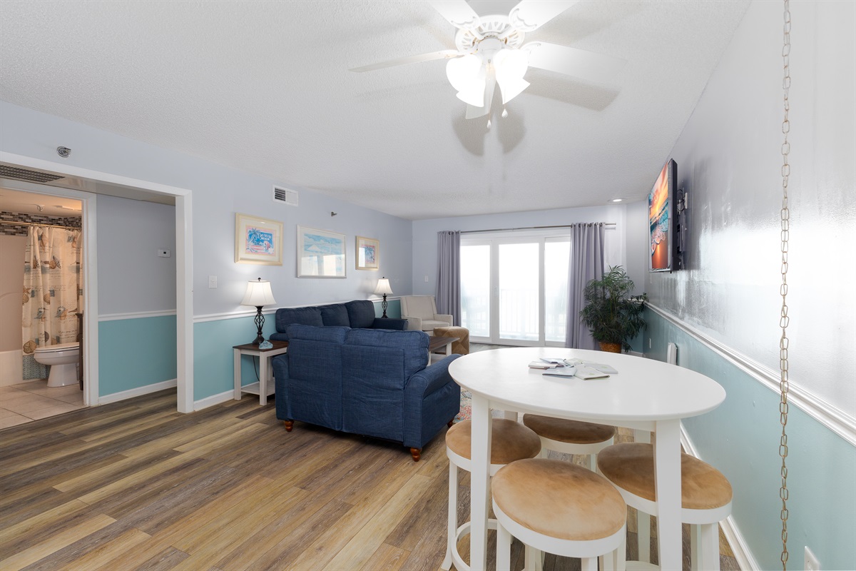 Open-concept living area with dining table and sofa