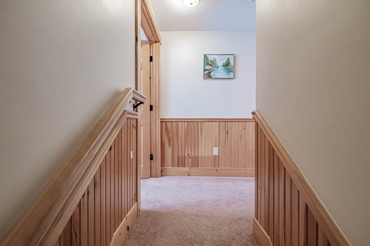 A sturdy staircase with natural wood finishes guides you to the second floor.  Emotional & Inviting: