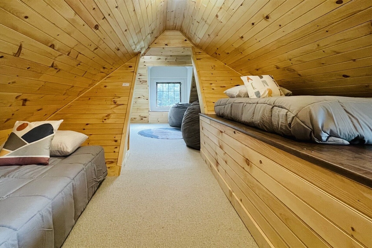 Twin beds off of the TV area