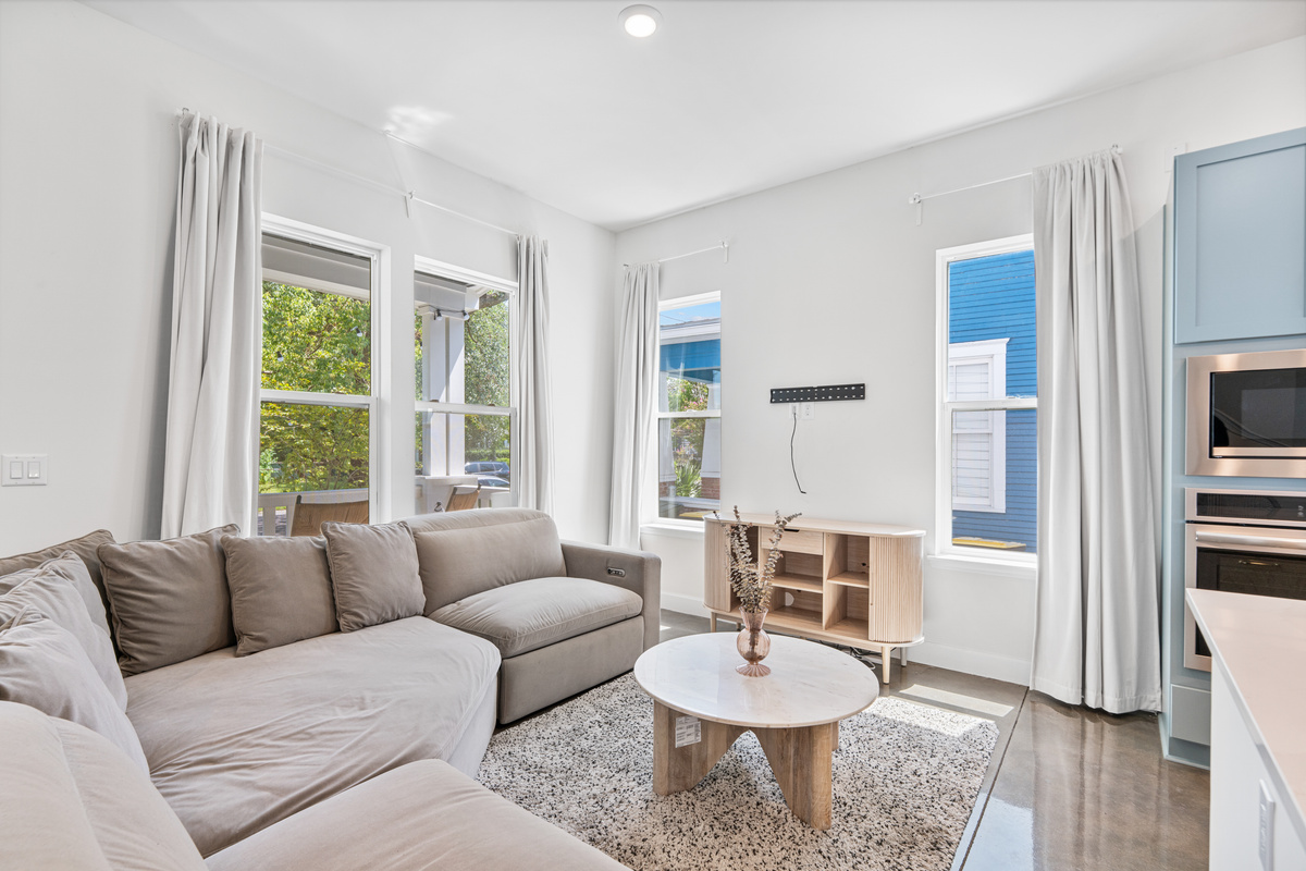 Sink into the sectional with the whole crew close by, the kitchen just steps away and afternoon light pouring through tall windows. This is the room where the day winds down and nobody quite wants to head to bed.