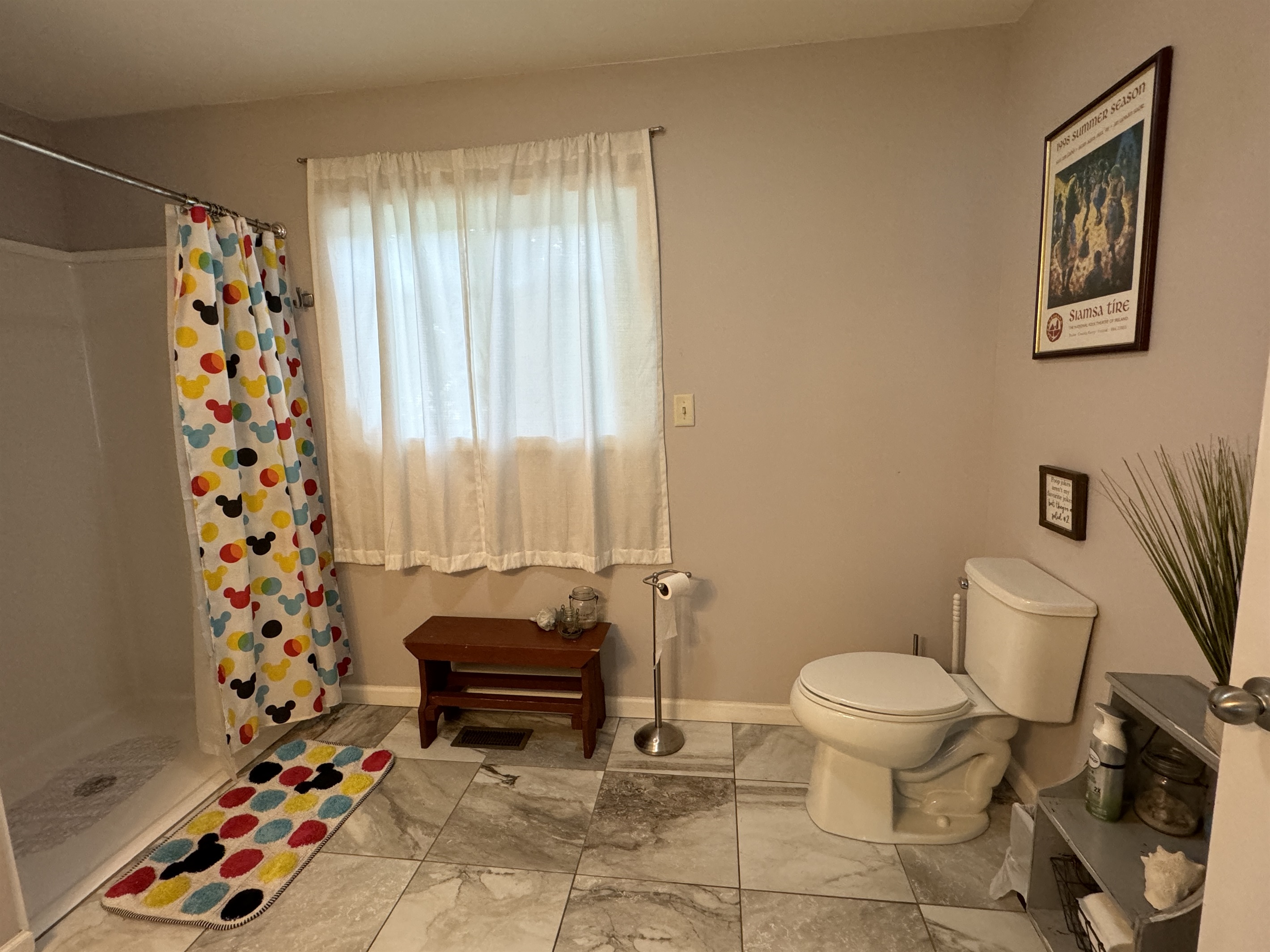 1st Floor full bathroom with wide shower.
