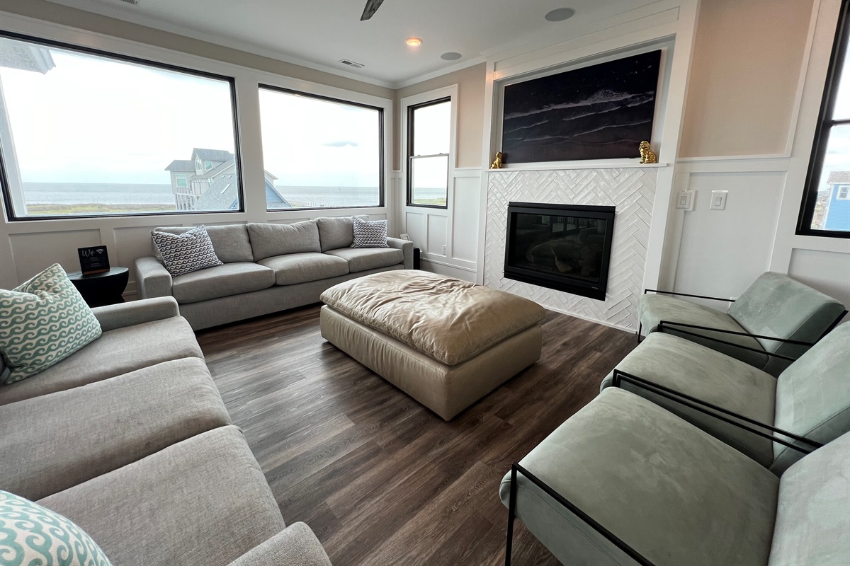 More seating, indoor fireplace, tv and look at those views!