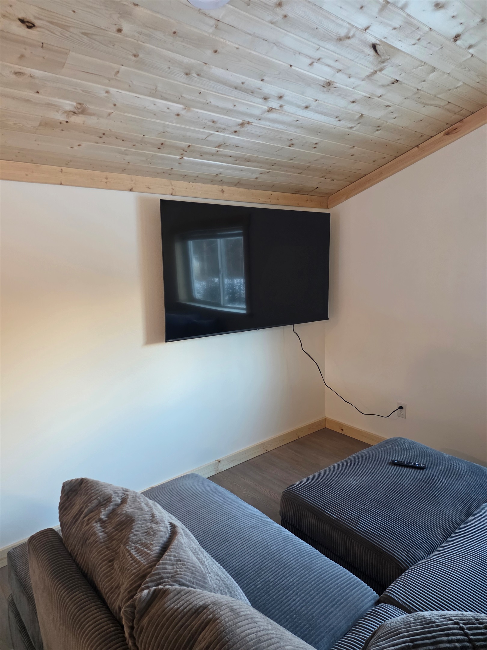 Loft living area - sectional sofa and big screen TV