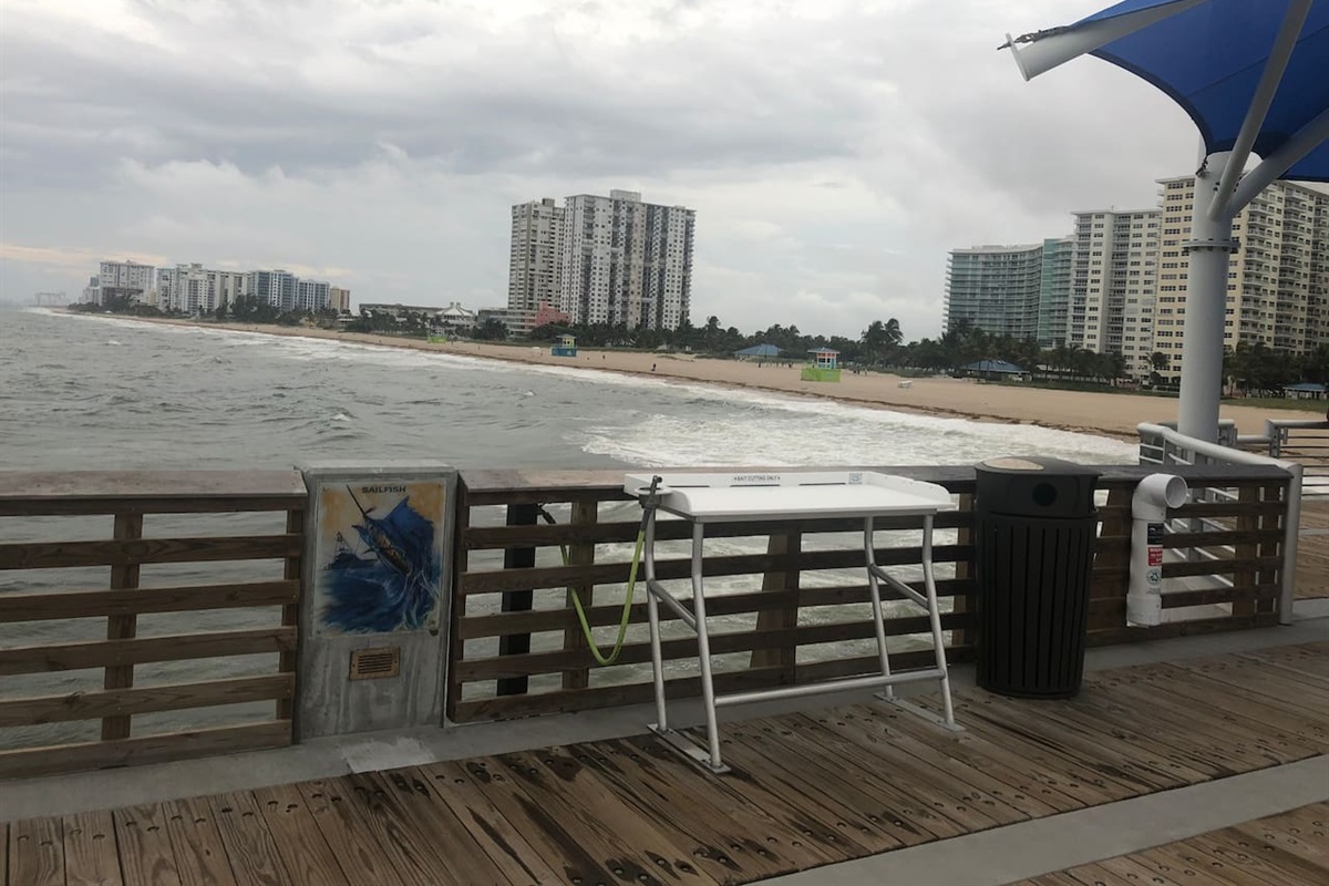 Pompano Beach Fishing Pier with fillet table and rod storage.