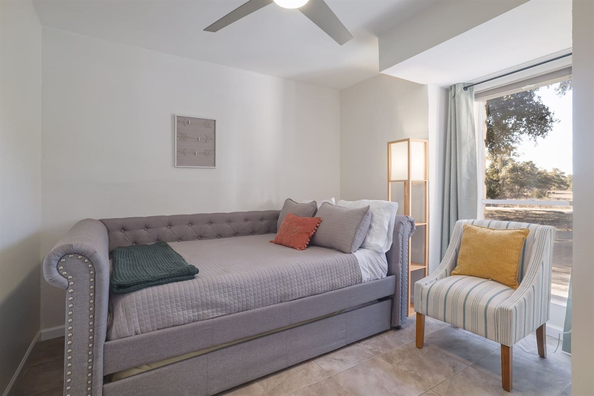 Bright and peaceful, this downstairs double bedroom offers a cozy place to recharge with soft natural light and comfortable touches throughout. Perfect for quiet mornings, afternoon naps, or winding down after a full day out.