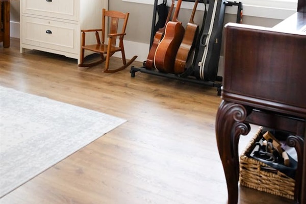 Our library features three work spaces, two comfy chairs for reading, PLENTY of books (we love the classics!), children's art supplies & crafts, as well as a piano and a few guitars. Beautiful views from these windows too. Open to living room/foyer.