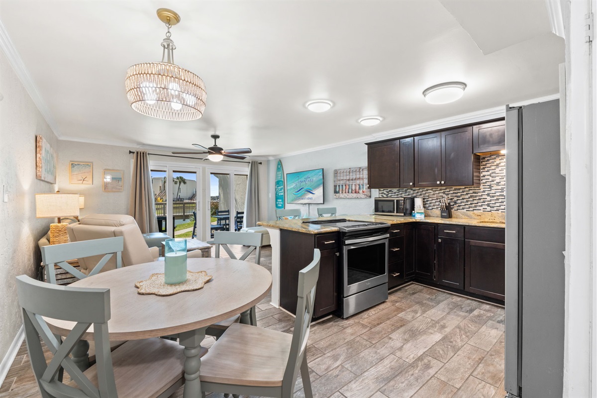 Dining Area, Kitchen, and Living Room with 2 Twin Pullout Ottoman Beds