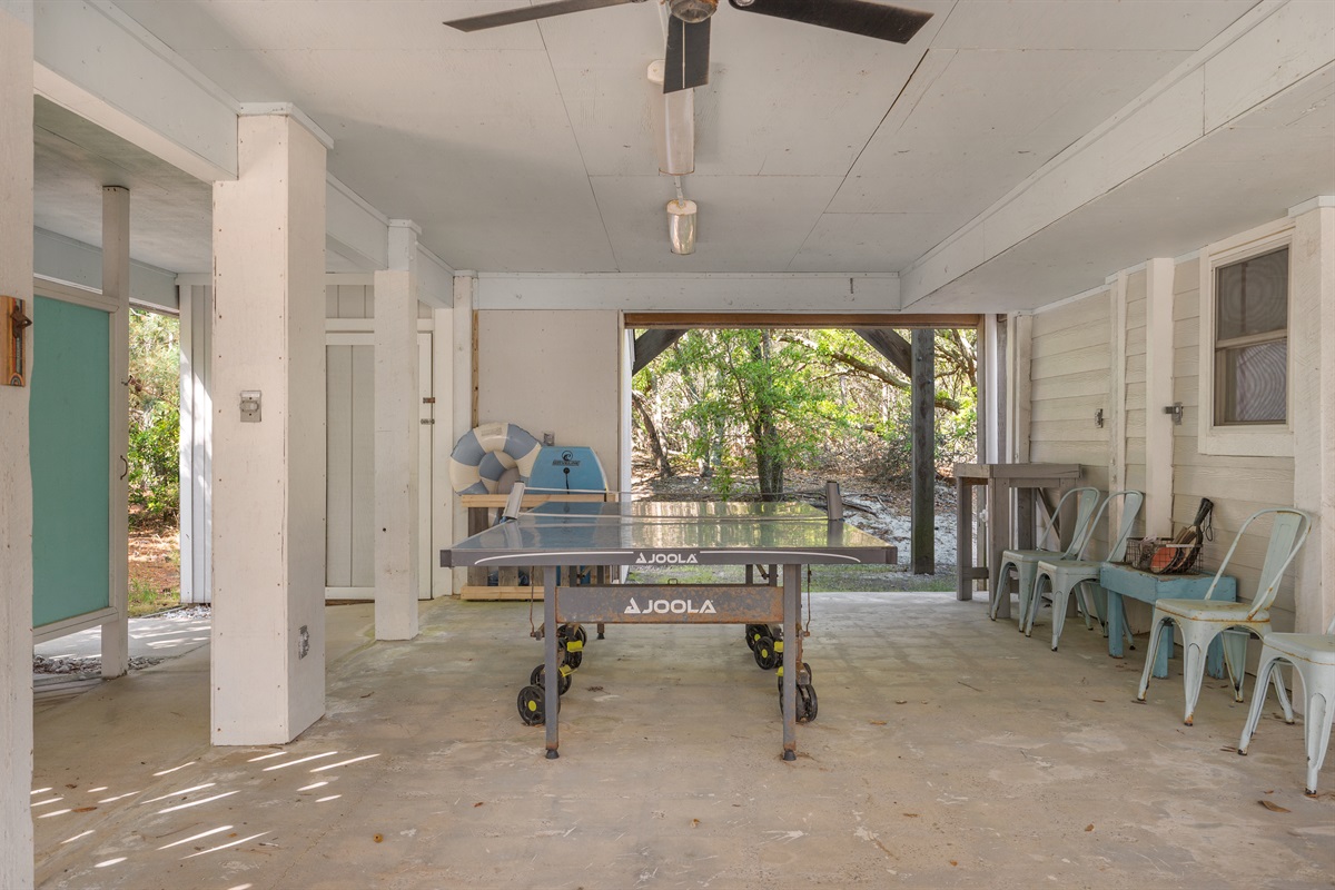 Lower-level game and gathering area featuring ping pong and plenty of seating.