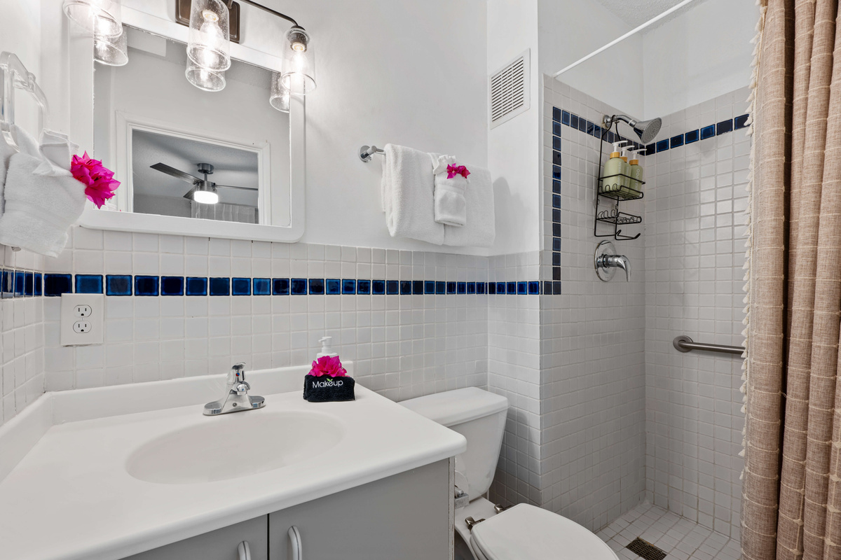 A clean, modern bathroom conveniently located just steps from the guest bedroom.