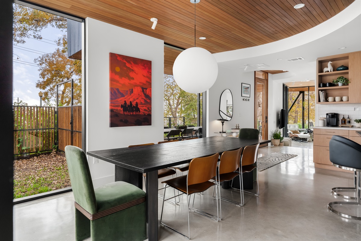 Stylish dining area with modern furnishings and indoor-outdoor vibes for effortless entertaining.