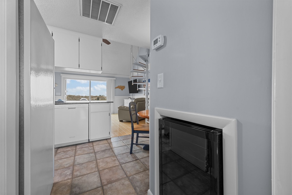 Convenient hallway access connecting the kitchen, living area, and laundry space seamlessly