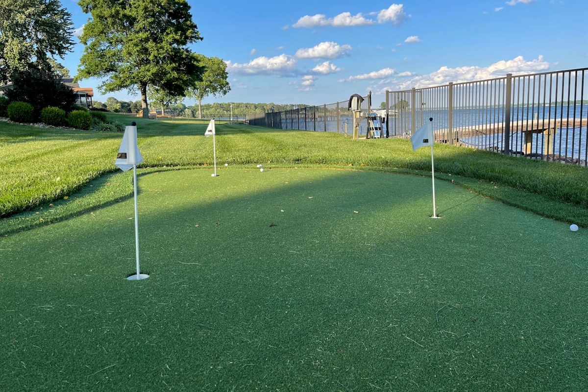 Golf putting green with 3 holes and fringe.