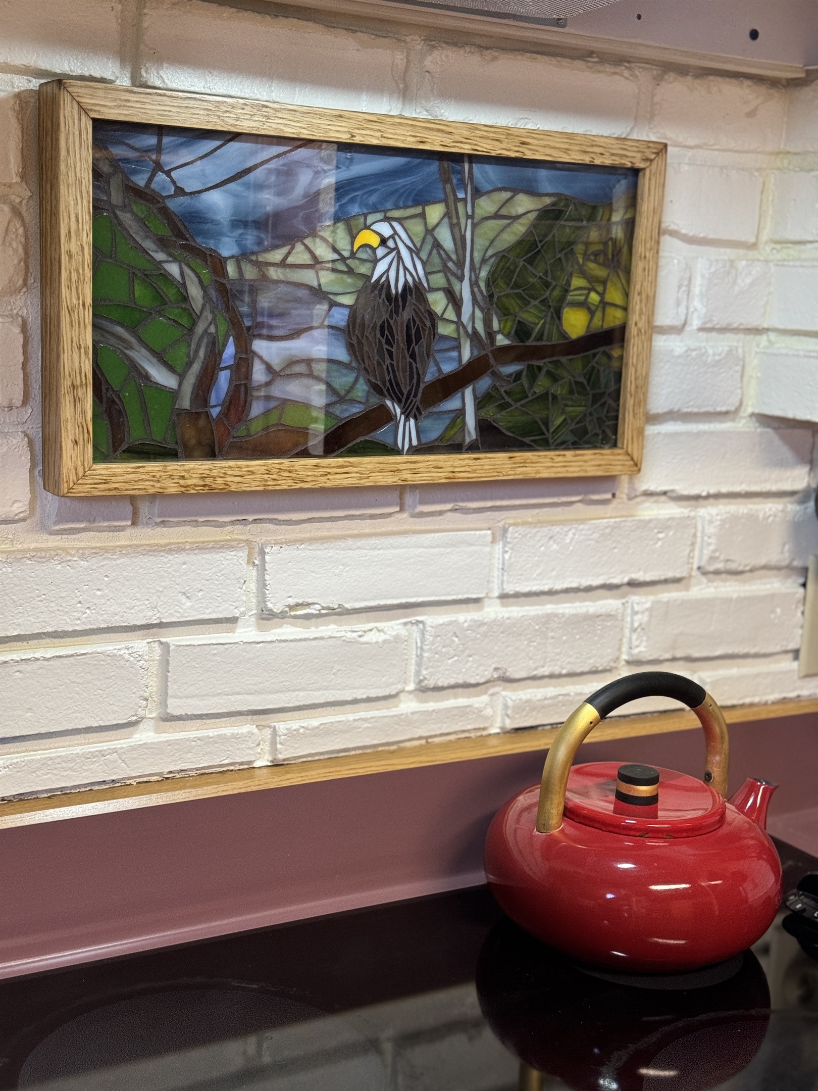 Camp Havon handcrafted stained glass depicting a bald eagle, which can be seen often on Goodyear Lake!  There is an eagle's nest near by!