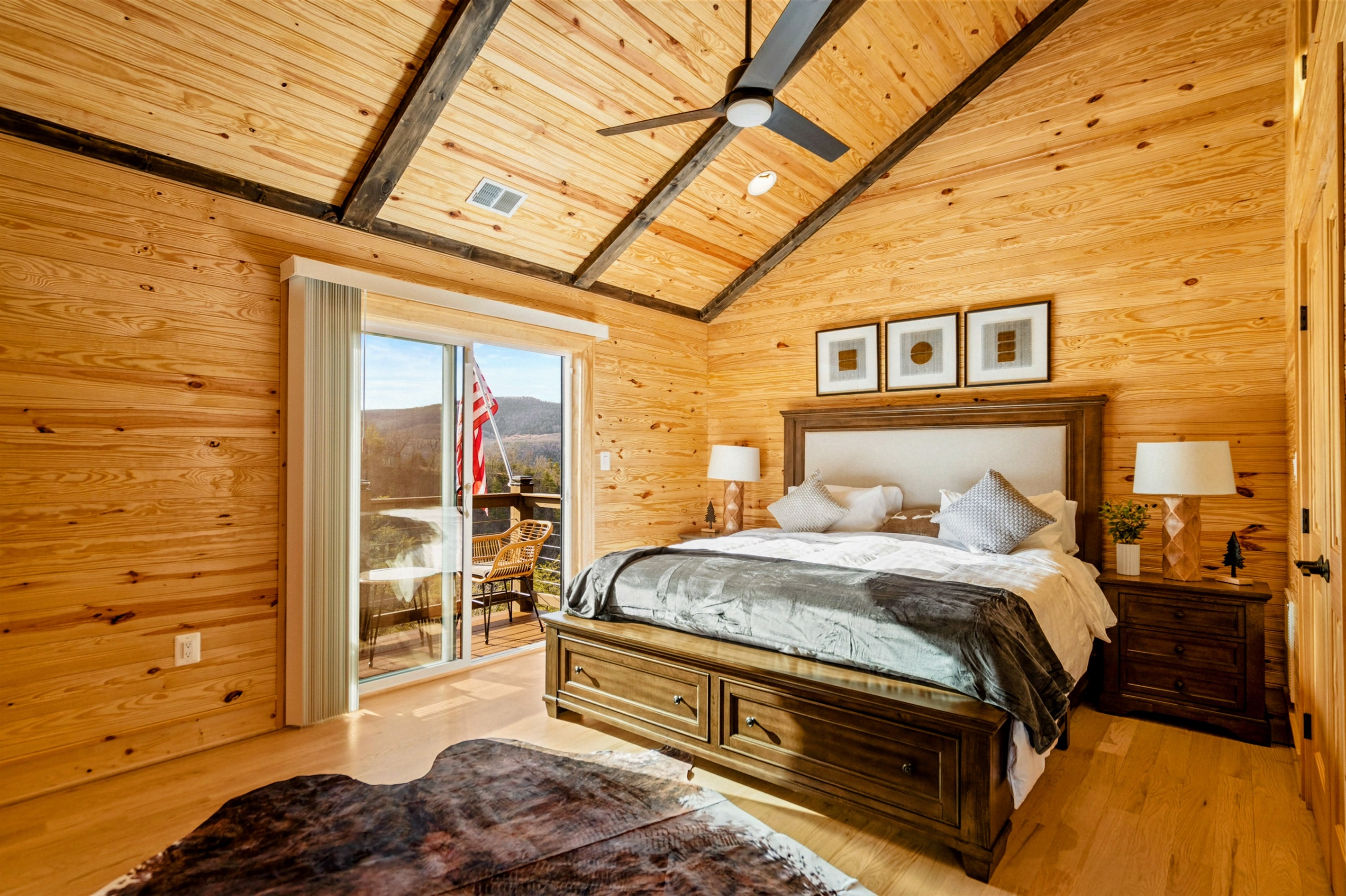 Primary Retreat – Vaulted ceilings, mountain views, and plush comforts create a restful private haven.