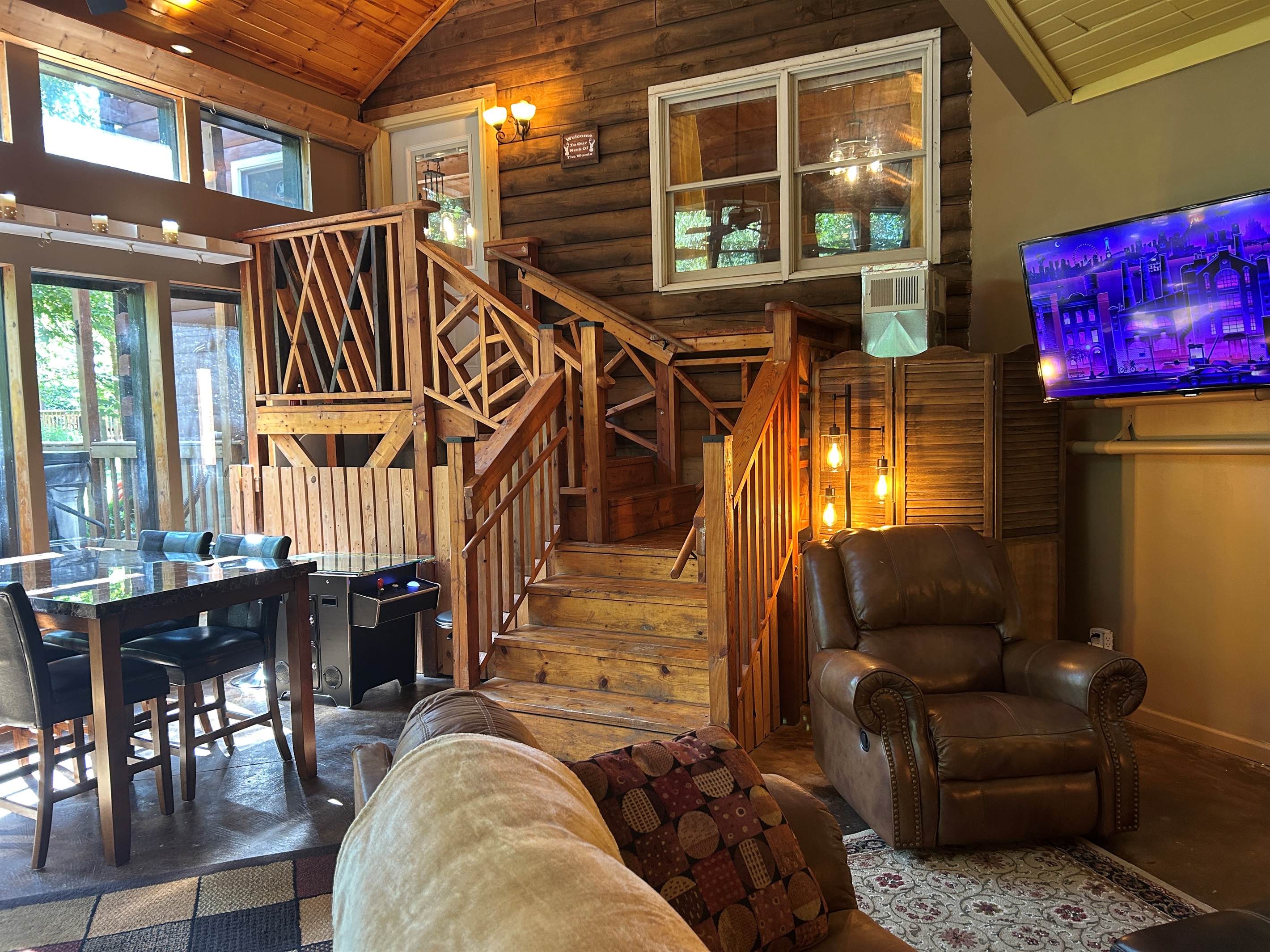 This climate controlled area is a nice gathering place between the Log Cabin and Guest Quarters. The entrance to the Log Cabin is at the top of the stairs.