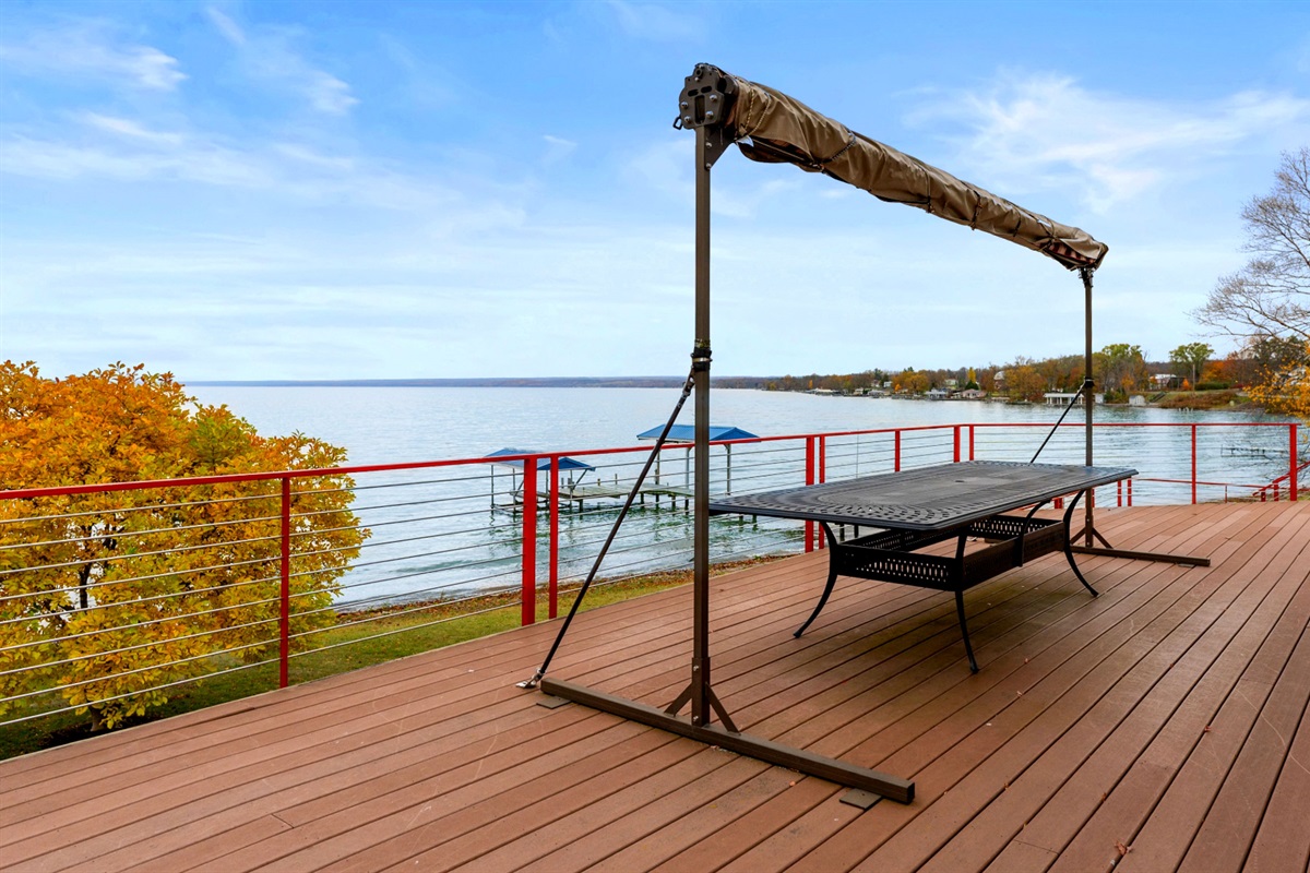 Large outdoor table for alfresco dining with sun shade for convenience