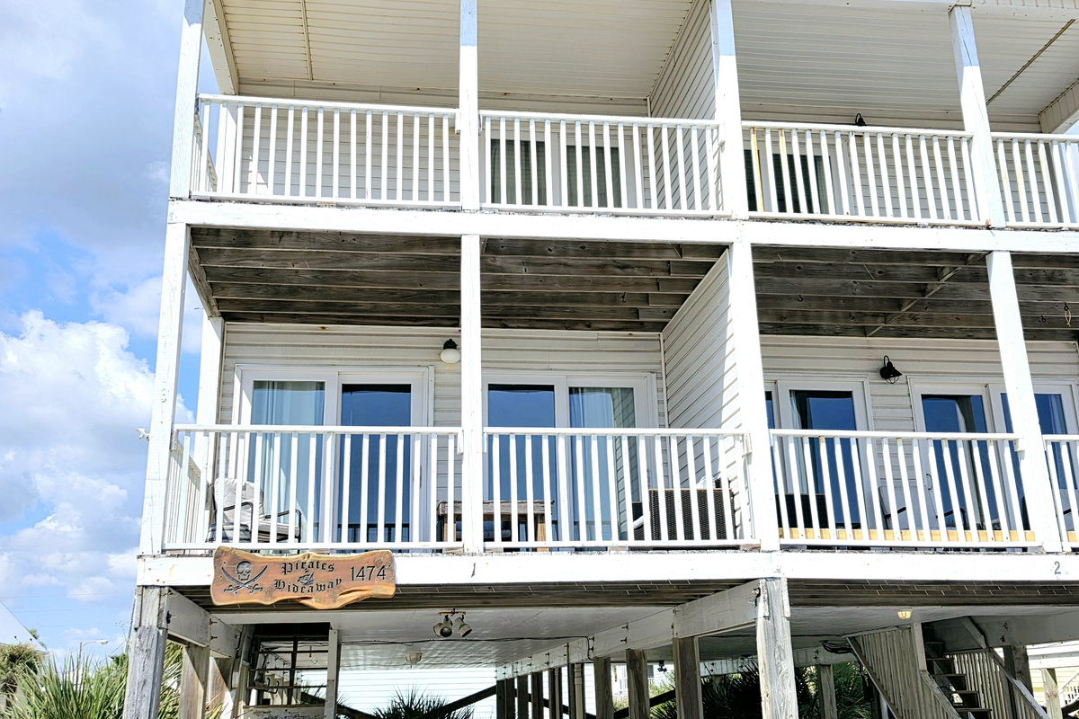 Covered balconies on both levels of the home