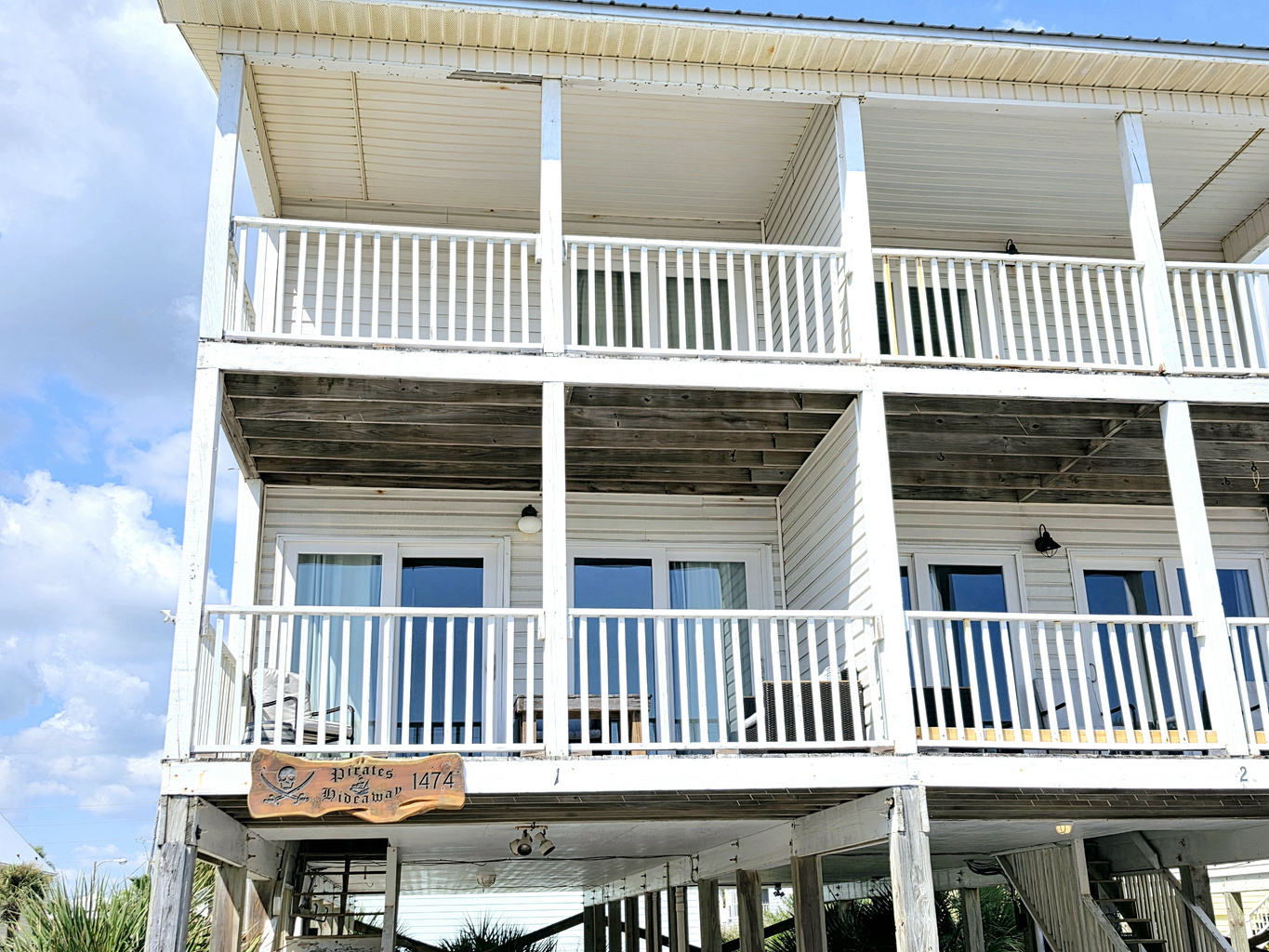 Covered balconies on both levels of the home