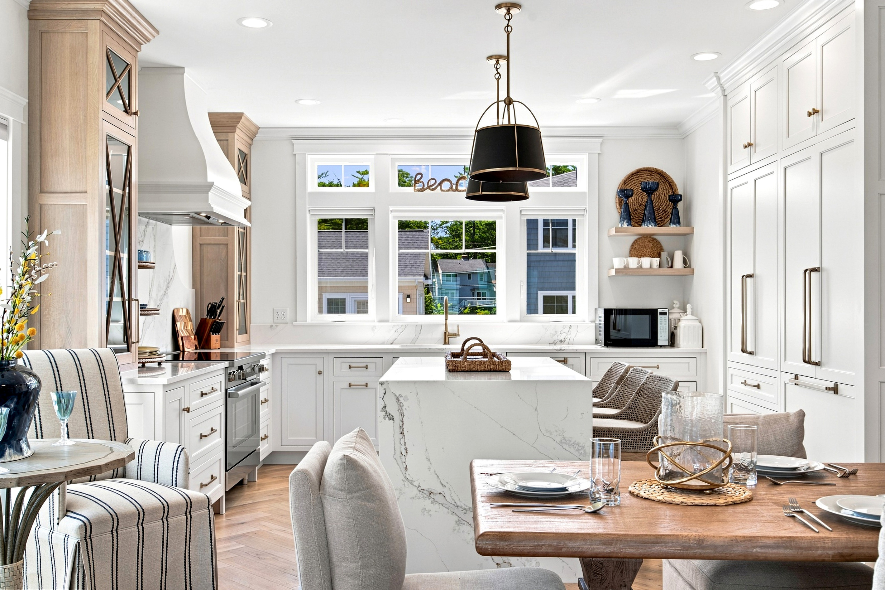 A bright, beautifully designed kitchen flows seamlessly into the dining area for effortless entertaining.