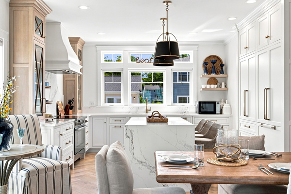 A bright, beautifully designed kitchen flows seamlessly into the dining area for effortless entertaining.