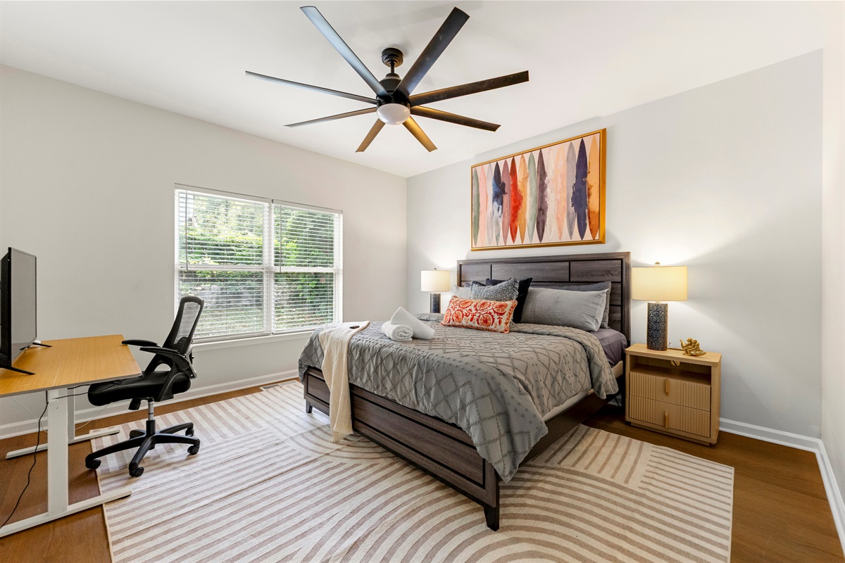 There's multiple king beds available for you! This one is on the 1st floor with it's own bathroom and workspace!