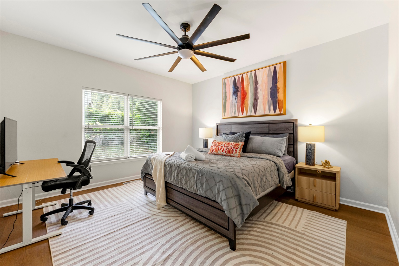 There's multiple king beds available for you! This one is on the 1st floor with it's own bathroom and workspace!