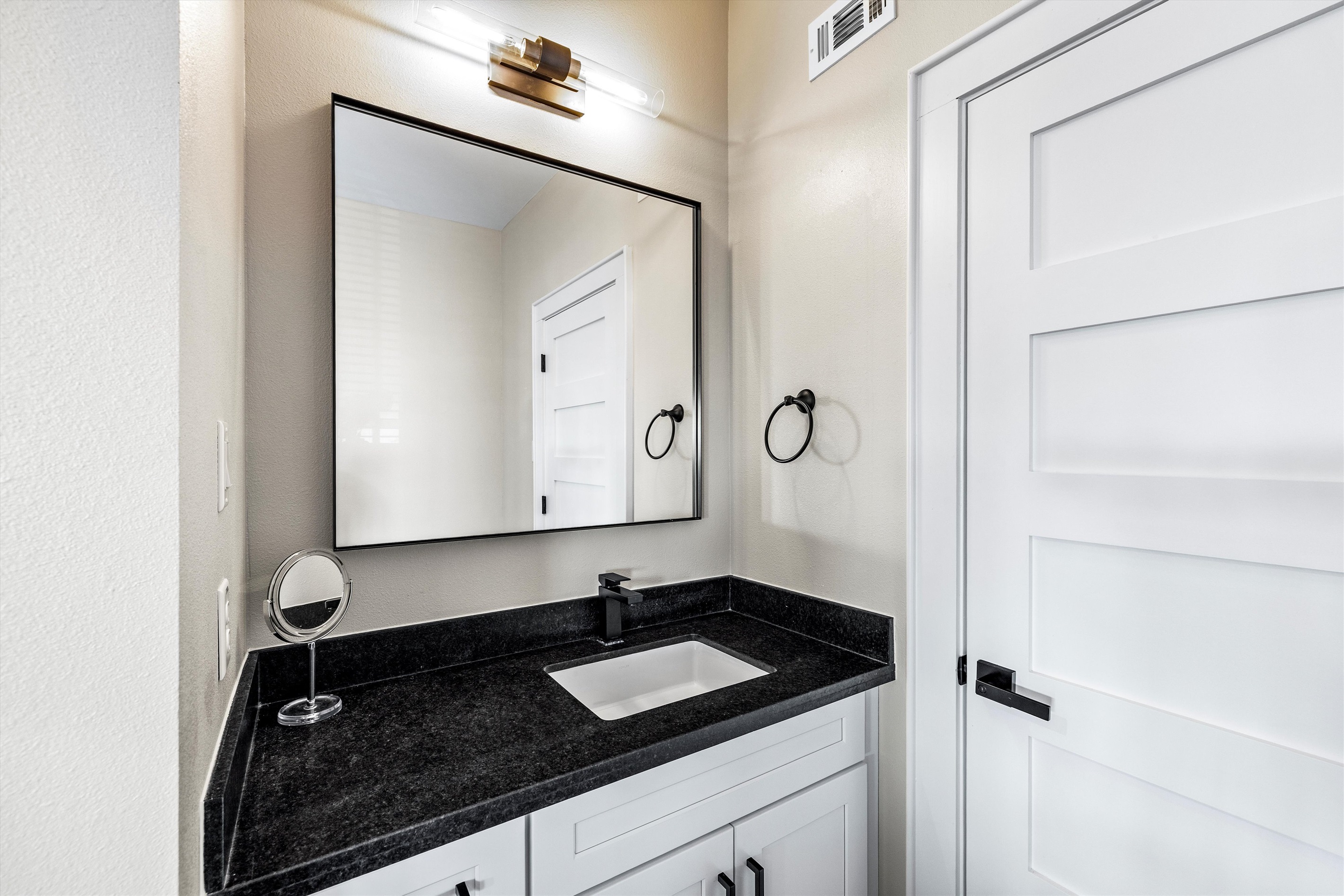Bathroom: Sleek design with modern finishes for a refreshing retreat after beach adventures!