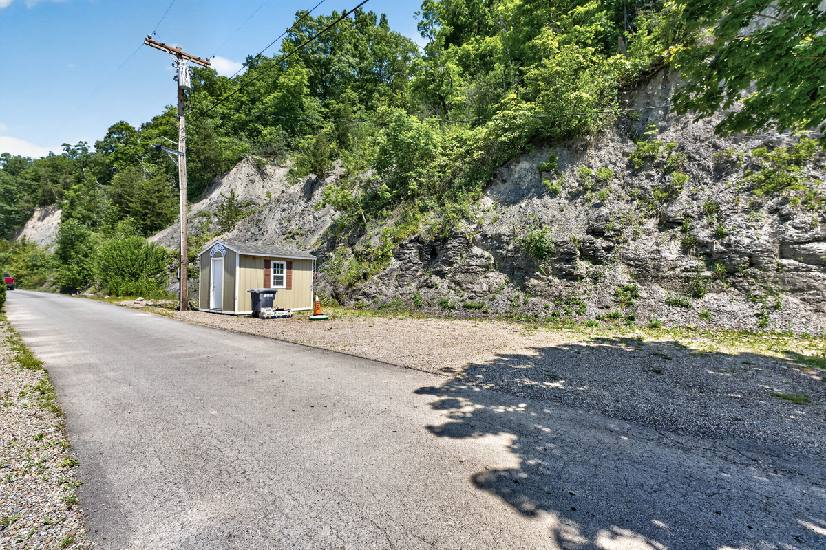 Rocky parking area beneath the hillside
