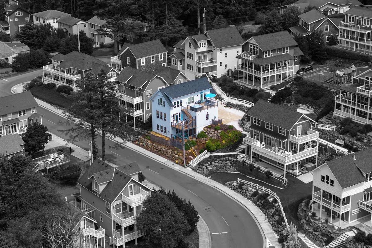 A striking three-level coastal home with multiple decks and generous space for family and group stays.