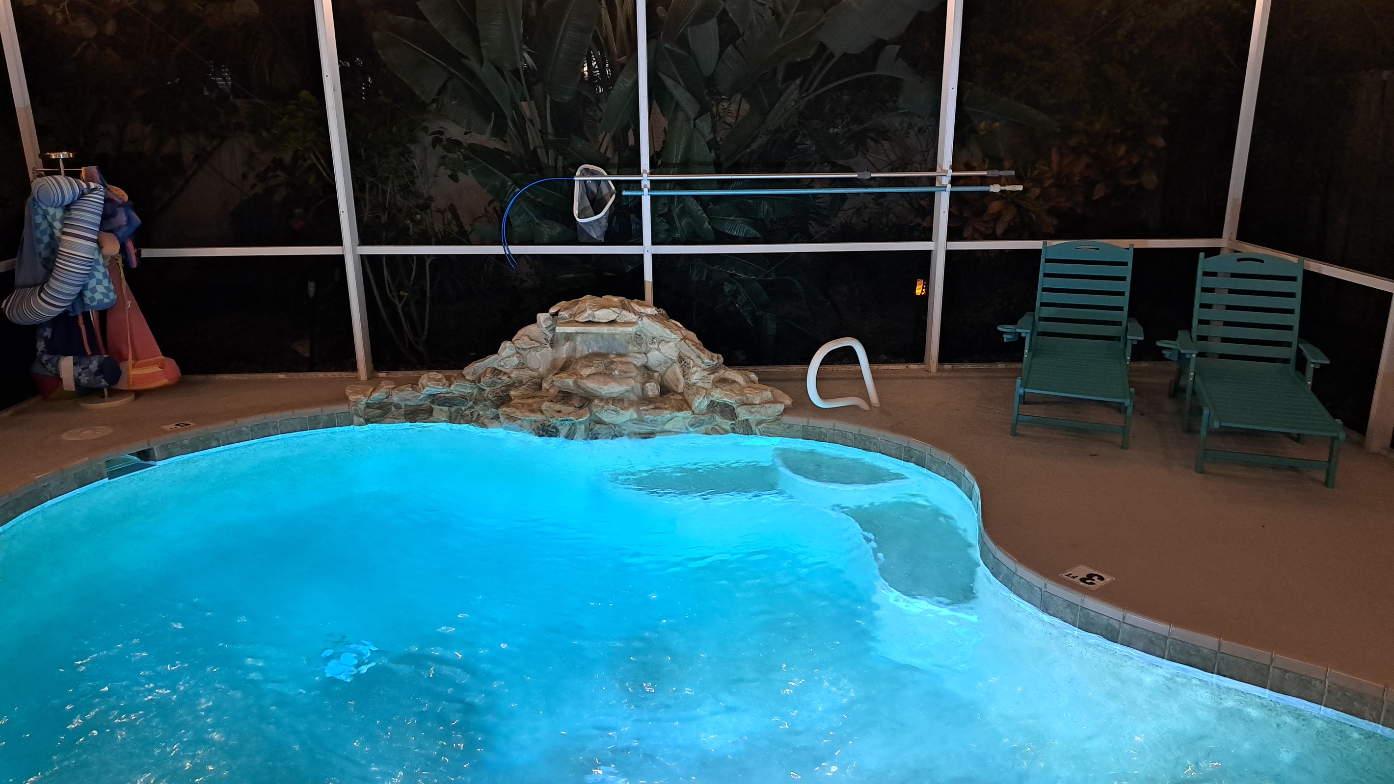 Wade into the heated pool after dark, waterfall lit and all yours.