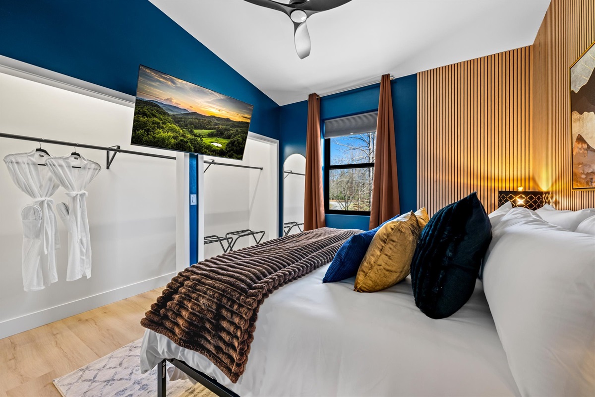 {King Bedroom + Closet} Unpack and settle in — a king suite with private ensuite and robes provided, elevated by Blue Ridge artwork and wood slat design for a grounded, relaxing feel.