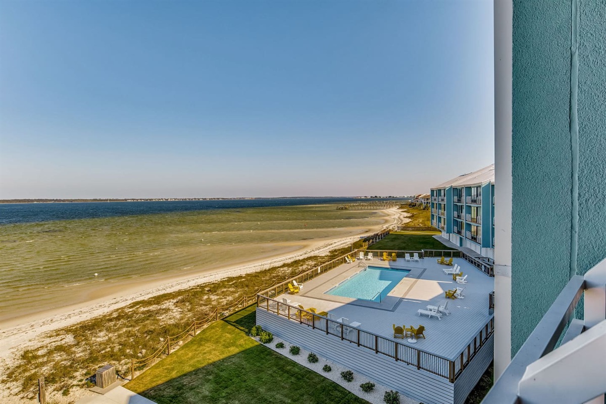View of the swimming pool from the upstairs balcony