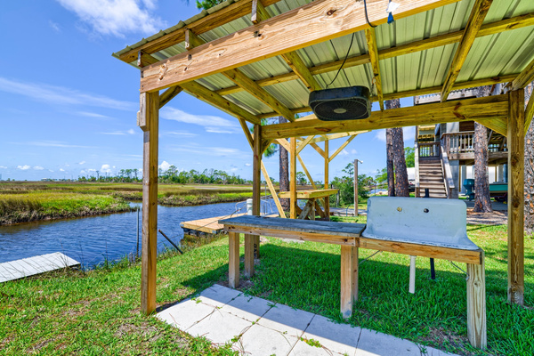Channel access, dock for two boats + fish cleaning station with fan