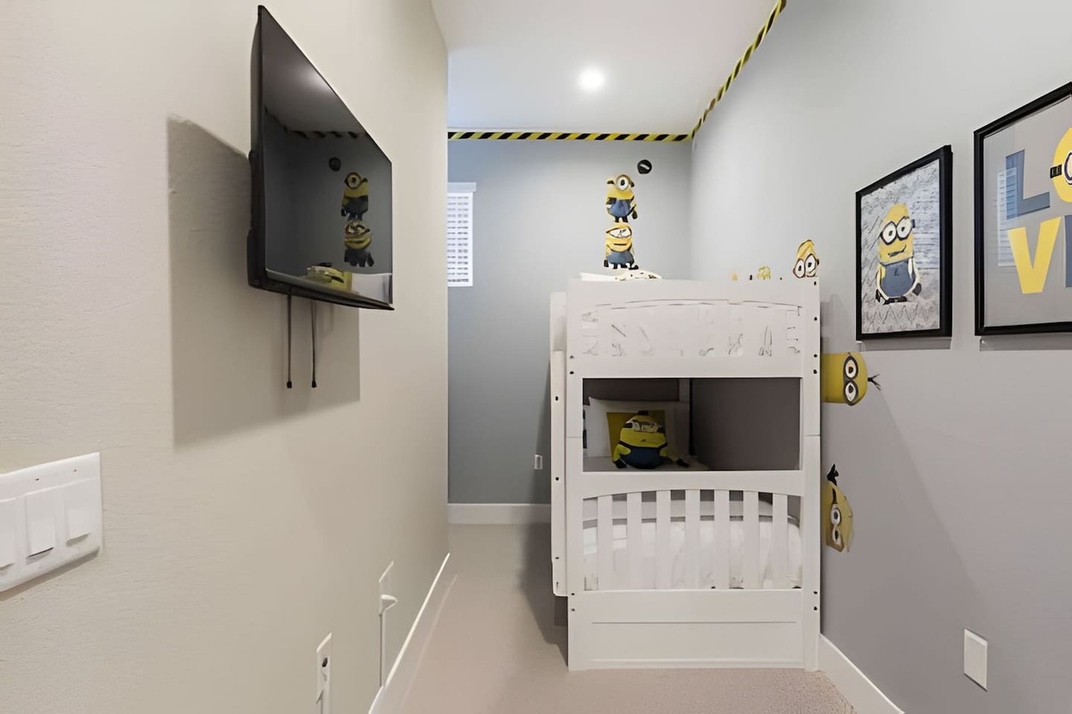 Fun room with bunk beds, a dresser, and TV. Perfect for kids or groups.