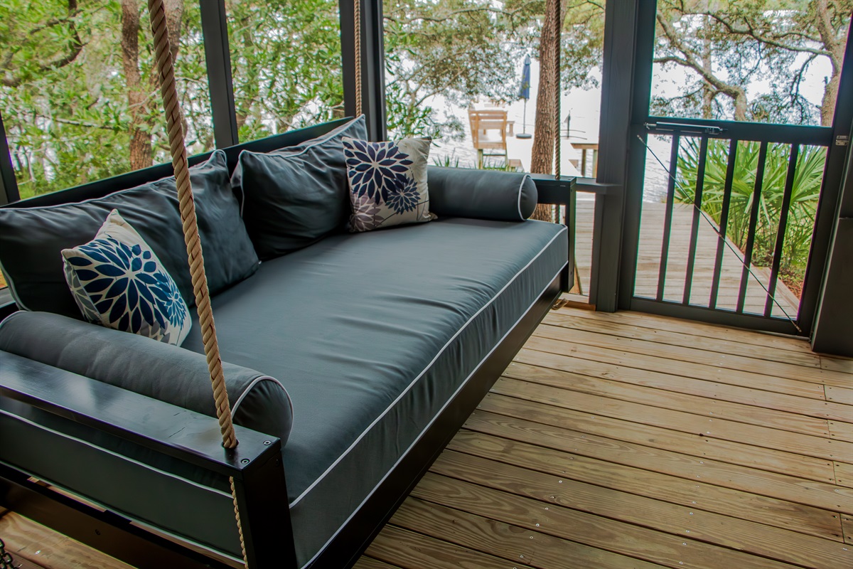 Relax on the porch daybed overlooking Eastern Lake