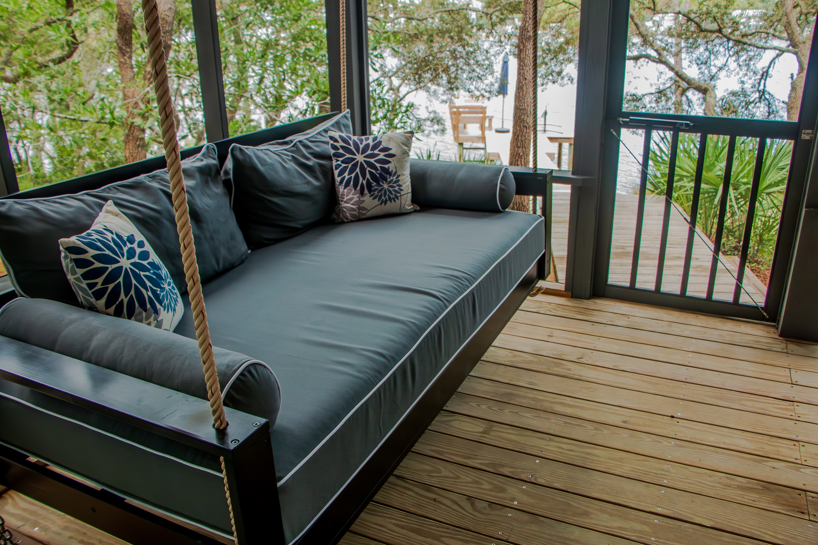 Relax on the porch daybed overlooking Eastern Lake