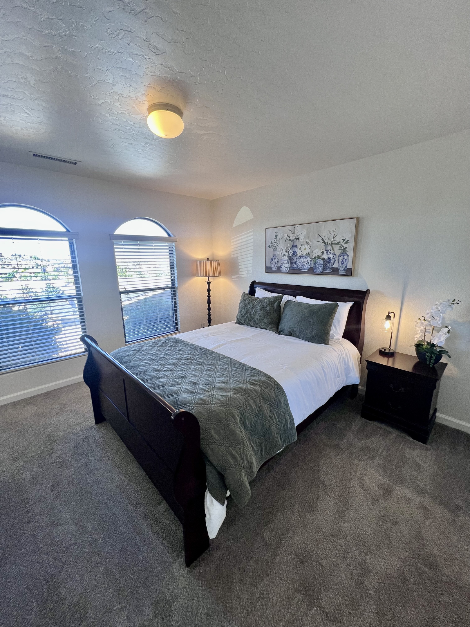 Enjoy a peaceful night's sleep in the inviting secondary bedroom, complete with a plush queen-size bed and soft linens.  Keep your belongings organized and easily accessible with the spacious closet, convenient drawers, and bedside nightstand.
