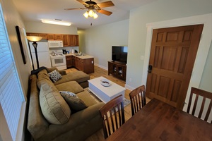 Cozy kitchen, living room, dining areas.