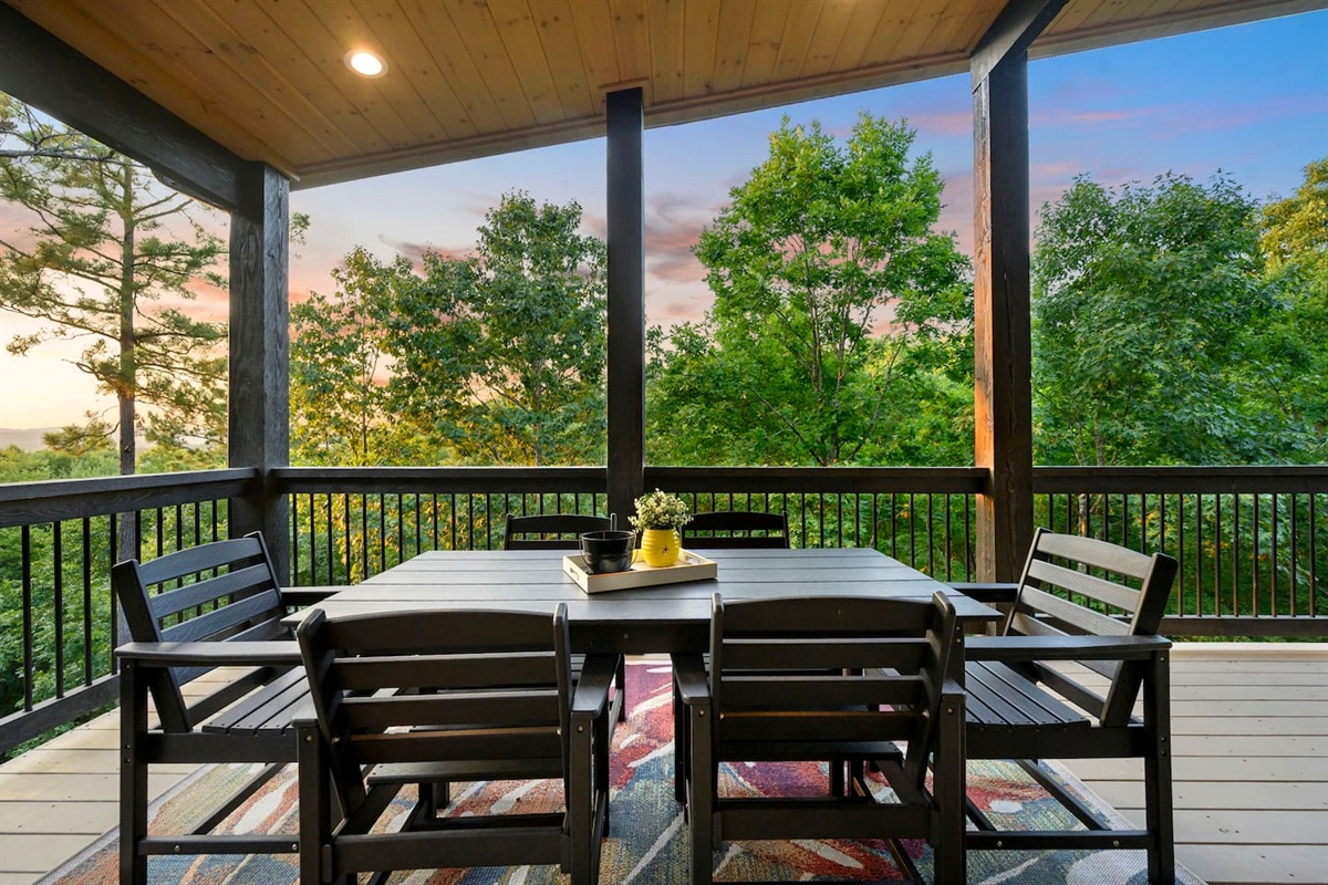 The outdoor dining set sits 6 comfortably and has panoramic views of the tree tops and the mountains to the West.  Definitely an experience to have a meal on this balcony.  Check out those views!