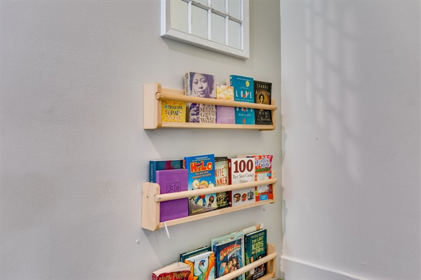 Cozy up in our little reading nook. Once a calming corner, now stocked with books for every age, & stories for every stay. This space invites you to slow down and enjoy a moment of peace.